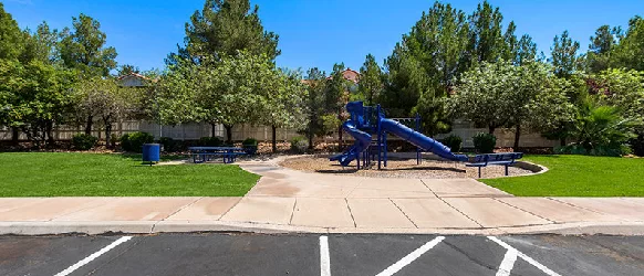Outdoor play area at Oasis Palms Apartments in St. George
