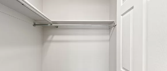 Walk-in closet inside an Oasis Palms apartment home