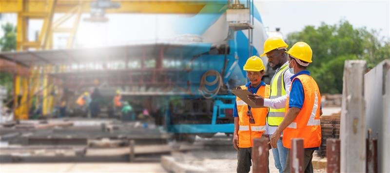 Construction manager talking with employees