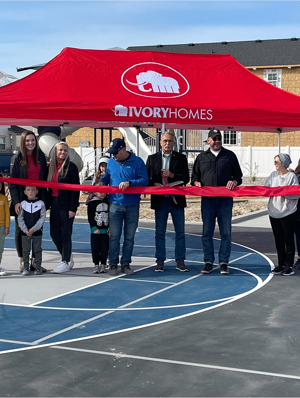 group of members cutting ribbon