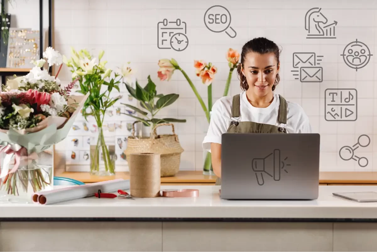 How to Market Your Small Business on a Budget - Blog Banner Image showing a woman using a Laptop for marketing